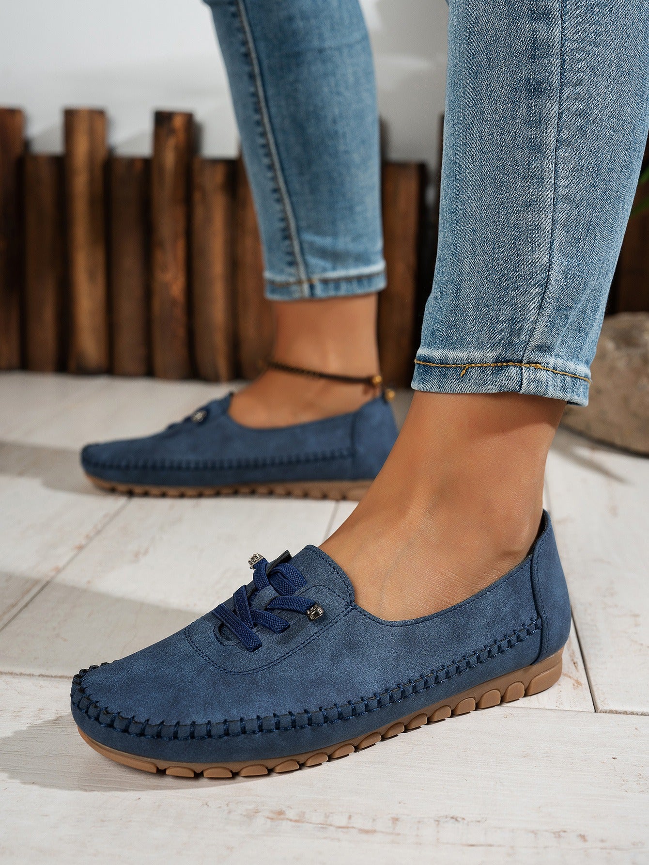 Blue women's soft loafers worn view