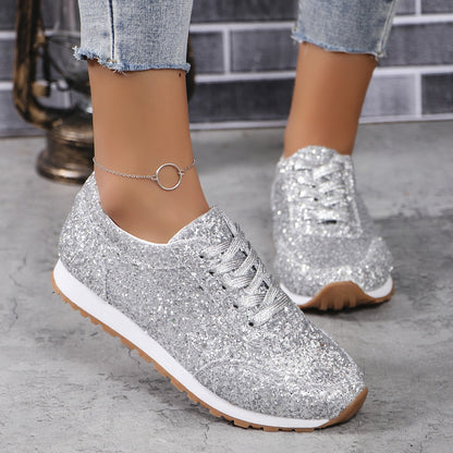 Silver glitter lace-up sneakers front view on foot