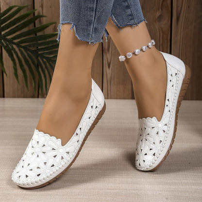 White breathable flat loafers pair on foot