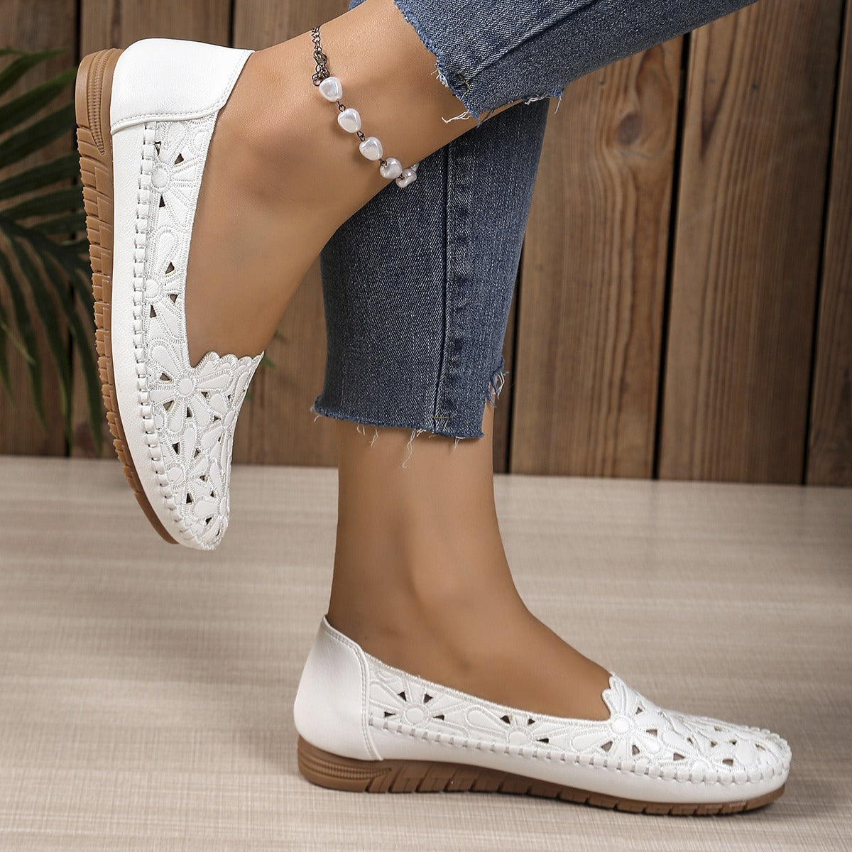 White floral cutout loafers profile view