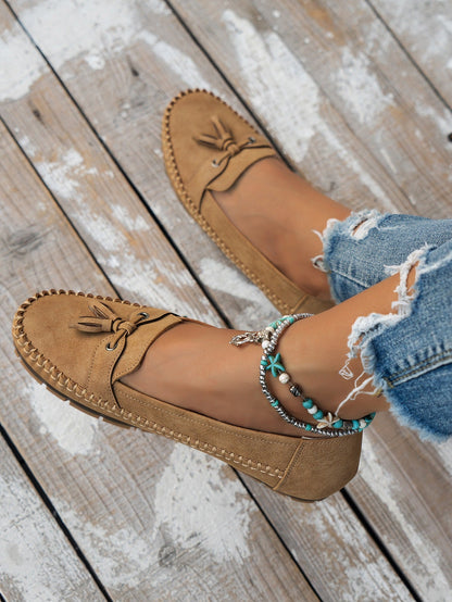 Women's apricot tassel loafers lifestyle side view
