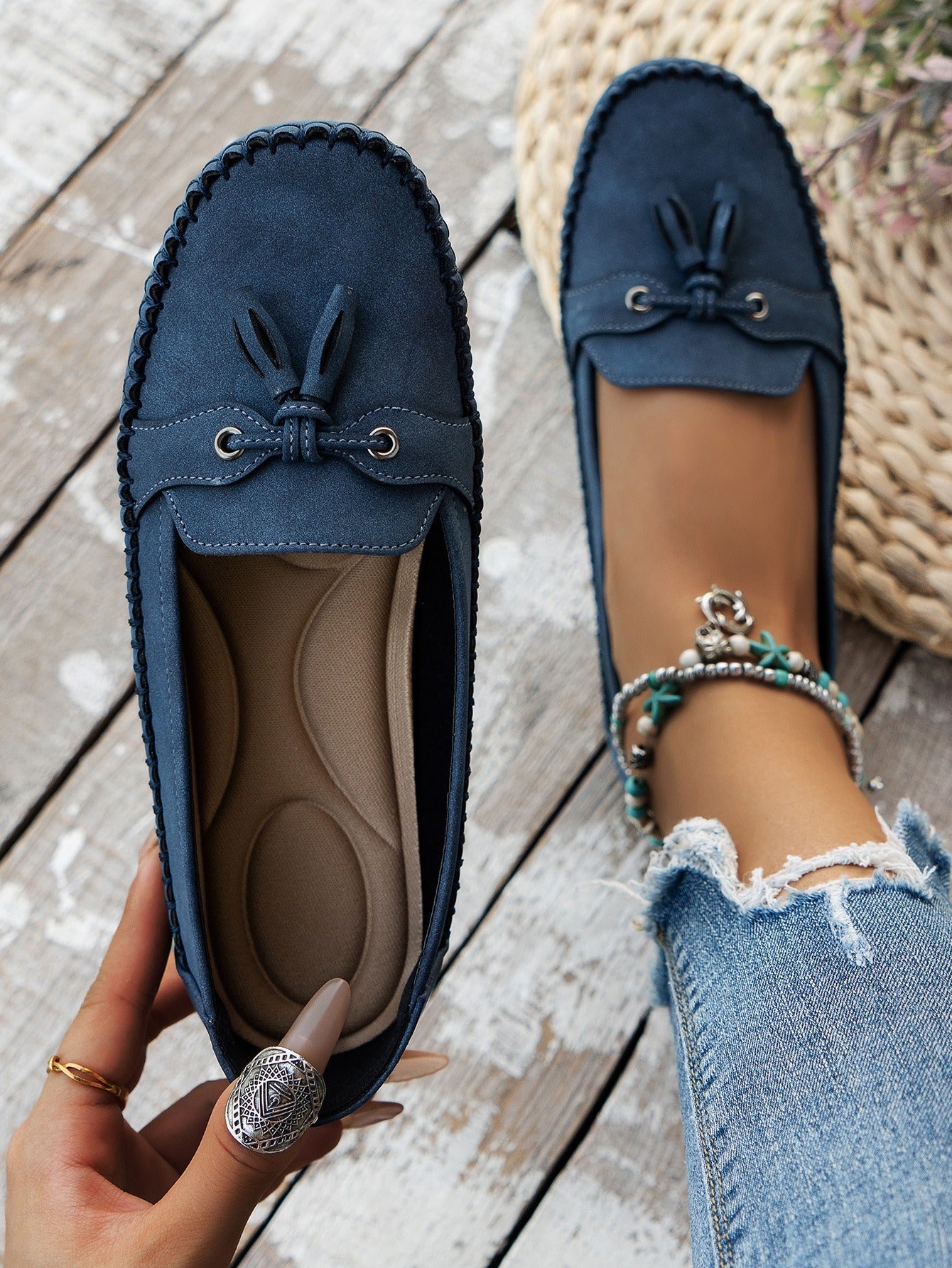 Women's blue tassel loafers top view and cushioned footbed