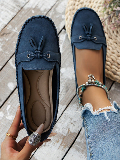 Women's blue tassel loafers top view and cushioned footbed