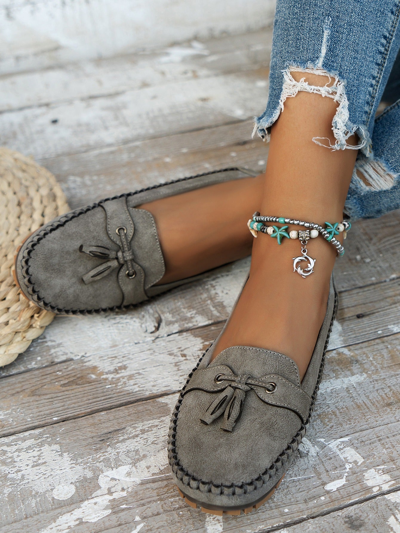 Gray tassel moccasin loafers stitched upper detail